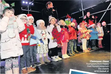  ?? 071217lark­hall_07 ?? Christmas cheer Youngsters from Happy Feet Nursery entertain the crowds