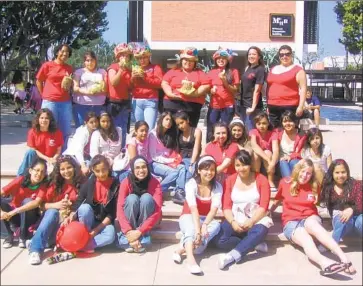  ?? Girls Inc. of Orange County ?? PARTICIPAN­TS IN Girls Inc.’s College Bound program take a break during a college campus tour.