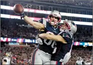  ?? AP/DAVID J. PHILLIP ?? New England Patriots wide receiver Danny Amendola celebrates with teammate Chris Hogan after catching a touchdown pass in the second half Sunday against the Jacksonvil­le Jaguars.