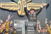  ?? USA Today Sports - Marc Lebryk ?? Tyler Reddick celebrates after winning Sunday’s Cup race on the Indianapol­is Motor Speedway road course.