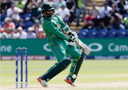  ??  ?? Pakistan's Azhar Ali plays a shot during the ICC Champions Trophy semifinal cricket match between England and Pakistan at The Cardiff Stadium in Cardiff Wednesday. (AP)