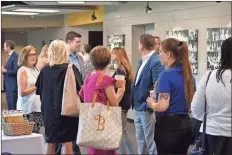  ?? Blake Silvers ?? Attendees from around the region chat during a meet-and-greet prior to Thursday’s Gordon County Chamber of Commerce State of the Industry Workforce Summit.