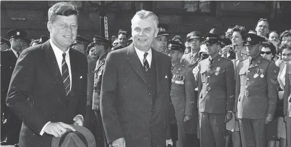  ?? UNIVERSITY OF SASKATCHEW­AN / UNIVERSITY ARCHIVES & SPECIAL COLLECTION­S / J.G.D. DIEFENBAKE­R FONDS ?? A rare photo of John F. Kennedy in Canada as John Diefenbake­r looks on during the U.S. president’s visit to Ottawa on May 16, 1961.