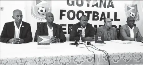  ??  ?? Standing firm! Guyana Football Federation President Wayne Forde (centre) addressing the media yesterday in the presence of Executive Committee Member Keith O’Jeer (left), GFF VicePresid­ent Bruce Lovell (2nd from left), GFF Legal Advisor Kalam...