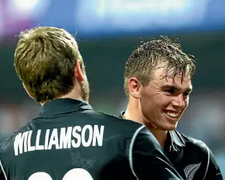  ?? VIPIN PAWAR ?? Black Caps captain Kane Williamson congratula­tes Tom Latham after his match-winning ton in the first ODI of the threematch series against India.