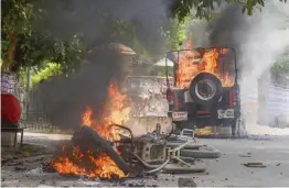  ?? — PTI ?? Vehicles up in flames after being torched by students of Allahabad Central University who were protesting in Allahabad on Tuesday against the university order asking them to vacate the hostel by June 12.