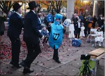  ?? ?? People dance during the Vacaville Chanukah celebratio­n and menorah lighting Thursday.