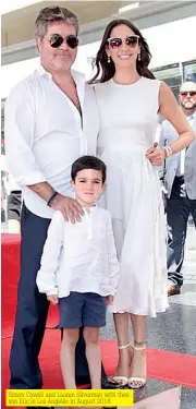  ??  ?? Simon Cowell and Lauren Silverman with their son Eric in Los Angeles in August 2018