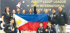  ??  ?? The Philippine Robotics National Team “Kid Imagineers” from Dr. Yanga’s College, Inc. with Ms. Mylene Abiva of FELTA MultiMedia (leftmost) and Coach Romyr Gimeno (rightmost) at the FLL European Open Internatio­nal Turkey 2019