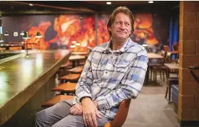  ?? ADOLPHE PIERRE-LOUIS/JOURNAL ?? Zinc Wine Bar & Bistro co-owner Kevin Roessler sits at the bar of the Nob Hill restaurant as it gears up for reopening.