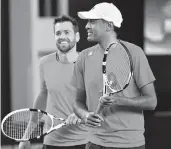  ?? AP ?? Austin Krajicek, left, and Rajeev Ram of the U.S. react during a Davis Cup doubles win over Uzbekistan.