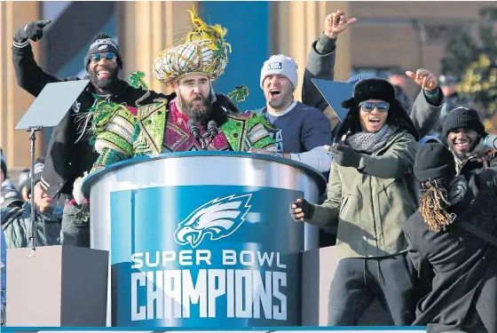  ??  ?? The Eagles’ Jason Kelce speaks to fans during the Super Bowl victory parade in Philadelph­ia.