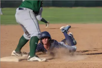  ?? Eddy Martinez/The Signal (See additional photos on signalscv.com) ?? Saugus baseball’s rising sophomore Evan Jabbaz slides to third base at the top of the third inning in a game against the Cowboys on Friday at Canyon. The Centurions won 14-3.