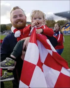  ??  ?? Andrew and Barry McNabb decked out in the red and white.