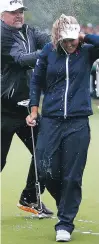  ?? VAUGHN RIDLEY/GETTY IMAGES ?? Brooke Henderson is doused in champagne by dad Dave after winning the CP Women’s Open Sunday in Regina.