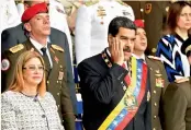  ?? — AFP ?? Venezuelan President Nicolas Maduro gestures during the ceremony in support of the National Guard in Caracas on Saturday.