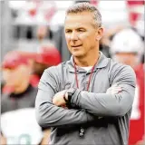  ?? DAVID JABLONSKI/STAFF ?? Ohio State coach Urban Meyer may have won over a few recruits at the annual “Friday Night Lights” event on campus.