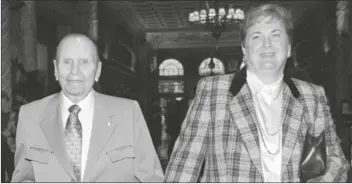  ?? ASSOCIATED PRESS ?? CALIFORNIA ANGELS OWNERS GENE
AUTRY AND HIS WIFE, JACKIE, leave the Baseball Owners Associatio­n meeting in Los Angeles, Jan.
18, 1996, after the owners unanimousl­y approved the Walt Disney Company's bid to assume control of the Angels from Autry.