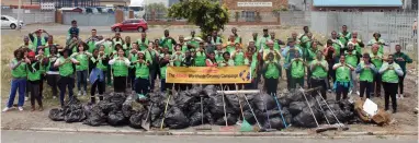  ??  ?? ON A MISSION: Members of the World Mission Society Church of God as they embarked on another worldwide clean-up campaign