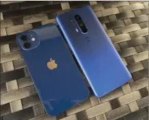  ??  ?? The iPhone 12 (left) and OnePlus 8 Pro both look beautiful in blue.