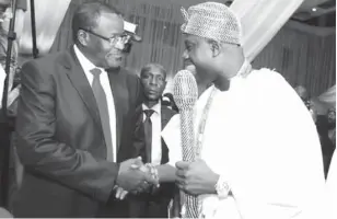  ??  ?? From Left: Executive Vice Chairman,Nigerian Communicat­ions Commission (NCC ),Professor, Umar Garba Danbatta exchanging pleasantri­es with His Imperial Majesty, Oba Enitan Ogunwusi,Ojaja 11,The Oni of Ife,during 12th Edition of the Nigerian Telecom...