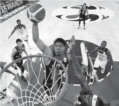  ?? NG HAN GUAN/AP ?? Rui Hachimura goes up for a dunk Thursday during Japan’s Group E game against the United States at the FIBA World Cup in Shanghai.