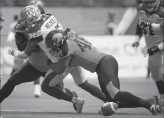  ?? CANADIAN PRESS FILE PHOTO ?? B.C. Lions’ Maxx Forde, right, rocks Winnipeg Blue Bombers quarterbac­k Matt Nichols in Vancouver in July, forcing a fumble. Forde has started all 10 games for the Lions this Canadian Football League season.