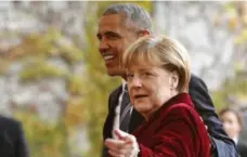  ?? FABRIZIO BENSCH/REUTERS ?? U.S. President Barack Obama held a final meeting with German Chancellor Angela Merkel this week. They talked of the need "to stand up to Russia."