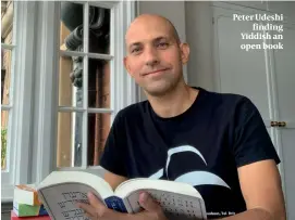  ??  ?? Peter Udeshi finding Yiddish an open book