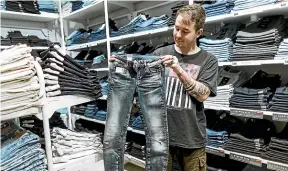  ?? ROSA WOODS / STUFF ?? Daniel Steer has noticed fewer Hurricane Jeans customers buying skinny jeans. Gen Z has mocked the look but Millennial­s are fighting back.