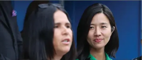  ?? NANCY LANE/HERALD STAFF FILE ?? FROM OLD TO NEW: Mayor Michelle Wu listens as Superinten­dent Dr. Brenda Cassellius speaks during an announceme­nt of a major investment in Boston Public Schools facilities during a press conference outside the McKinley Elementary School last week.