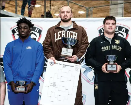  ?? COURTESY SAM JANICKI ?? Lehigh fifth-year senior Jordan Wood (Boyertown) stands atop the podium after winning the heavyweigh­t title at the EIWA Championsh­ips Saturday in Manheim.