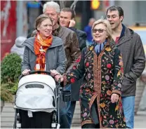  ??  ?? Above: Hillary with daughter Chelsea, husband Bill, son-in-law Marc and baby Charlotte.