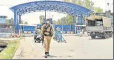  ?? ANI ?? A security personnel outside Jammu Air Force Station after the drone blasts, in Jammu.