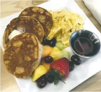  ??  ?? Kids ordering the Little Monkey meals won’t leave hungry. The Monkey Dollars plate has three sand dollar-size wholegrain pancakes, scrambled eggs and fruit. It is served with house-made syrup.