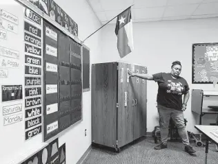  ?? Melissa Phillip / Staff photograph­er ?? Dornethia Dixon, a special education teacher, prepares her classroom at Reynolds Elementary in Spring ISD. Staff there must use their normal allotment of leave to take time off due to COVID-19.