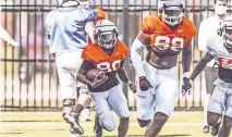  ?? COURTESY OF OSU ATHLETICS] ?? Oklahoma State true freshman Brennan Presley (80) from Bixby is working his way toward playing time this season. [BRUCE WATERFIELD/