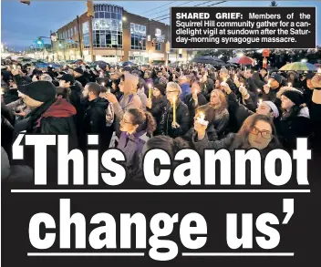  ??  ?? SHARED GRIEF: Members of the Squirrel Hill community gather for a candleligh­t vigil at sundown after the Saturday-morning synagogue massacre.