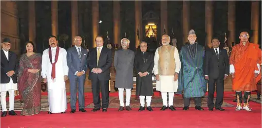  ??  ?? The President of India Pranab Mukherjee, the Vice President Mohd. Hamid Ansari and the Prime Minister Narendra Modi
with the Heads of SAARC countries after the swearing-in ceremony on May 26, 2014