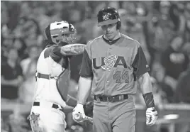  ?? GETTY IMAGES ?? Paul Goldschmid­t of the United States walks back to the dugout after striking out in the ninth inning of a World Baseball Classic Pool F game vs. Puerto Rico on March 17 in San Diego.