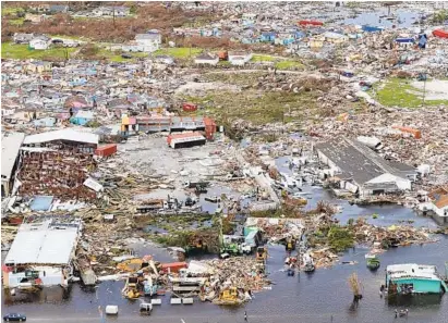  ?? PAUL HALLIWELL/AFP/GETTY IMAGES ?? A handout aerial photograph released by the United Kingdom Ministry of Defence on Wednesday shows debris and destructio­n in the aftermath of Hurricane Dorian on the island Great Abaco in the northern Bahamas on Tuesday during a reconnaiss­ance mission launched by personnel on board RFA Mounts Bay. Bahamian, U.S. and British teams increased rescue efforts Wednesday for survivors of the hurricane, which caused widespread devastatio­n as it pounded the Atlantic archipelag­o.