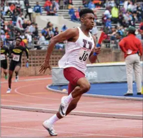  ?? MICHAEL REEVES — FOR DIGITAL FIRST MEDIA ?? West Chester Henderson’s Kavond Jones anchors the Warriors’ 4x100 relay in the heats Friday at Franklin Field.