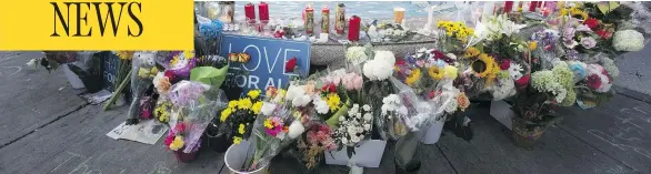  ?? ERNEST DOROSZUK/POSTMEDIA NEWS ?? A vigil was held Wednesday at the fountain in the centre of the Greektown neighbourh­ood in Toronto were two people were fatally shot Sunday. The crew of Pumper 323 was there.