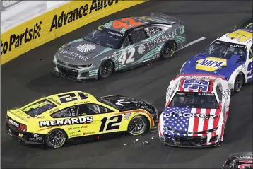  ?? PHOTOS BY MARK J. TERRILL — THE ASSOCIATED PRESS ?? NASCAR Cup Series driver Ryan Blaney (12) spins out and is hit by Daniel Suarez (99) during the Busch Light Clash NASCAR exhibition race at Los Angeles Memorial Coliseum on Sunday in Los Angeles.