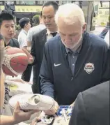  ?? Tim Reynolds / Associated Press ?? Coach Gregg Popovich and the U.S. men’s basketball team arrived in China on Thursday, focused on the World Cup.