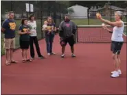  ?? TAWANA ROBERTS — THE NEWS-HERALD ?? YMCA volunteer Donna Klements explained and demonstrat­ed how to play pickleball on Sept. 17 at Jindra Park in Wickliffe.