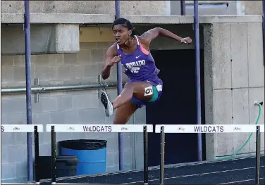  ?? Penny Chanler/Special to News-Times ?? Clearing hurdles: El Dorado's Addrienna Gray competes in the hurdles during last year's 5A South Track Meet at Memorial Stadium. The Lady Wildcats will open the track season Thursday at Prescott.