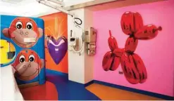  ??  ?? Photo provided by RxArt shows a CT Scanner room featuring three artworks by Jeff Koons, from left, Monkey, Hanging Heart (Violet/Gold) and Dog Balloon at Advocate Children’s Hospital in Oak Lawn, Ill.