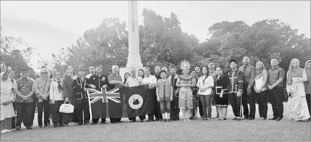  ??  ?? The delegates of Borneo Exhibition Group Incorporat­ed Perth Western Australia, led by Ryan Rowland with Labuan member of Parliament Datuk Rozman Isli after the Anzac Day Dawn Service at the Labuan World War II Memorial on April 25 this year. — Bernama...