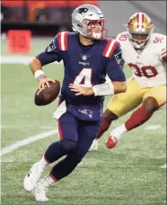  ?? Winslow Townson / Associated Press ?? New England Patriots quarterbac­k Jarrett Stidham looks to pass against the San Francisco 49ers during an NFL game at Gillette Stadium on Oct. 25 in Foxborough, Mass. Stidham is the lone QB under contract for next season with the Patriots.